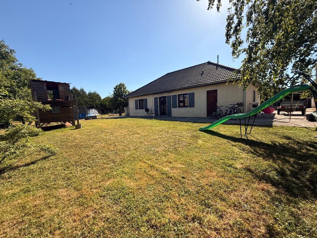 Maison de plain-pied - 3 chambres - terrain 1000 m² - garage