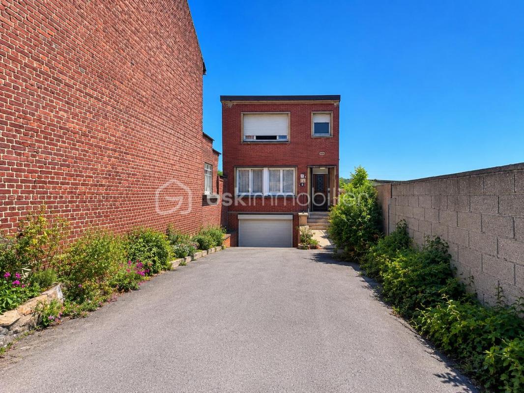 Maison individuelle 105 m² – 3 chambres – Garage en sous-sol – Jardin
