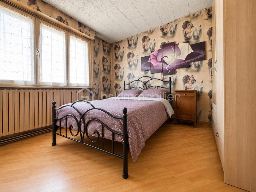 Maison individuelle 105 m² – 3 chambres – Garage en sous-sol – Jardin