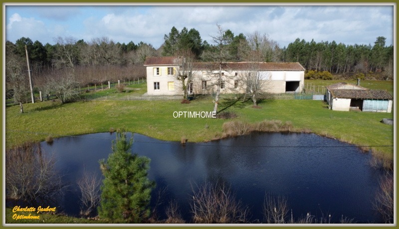 Ensemble de 2 maisons+ dependances + grand terrain + étang