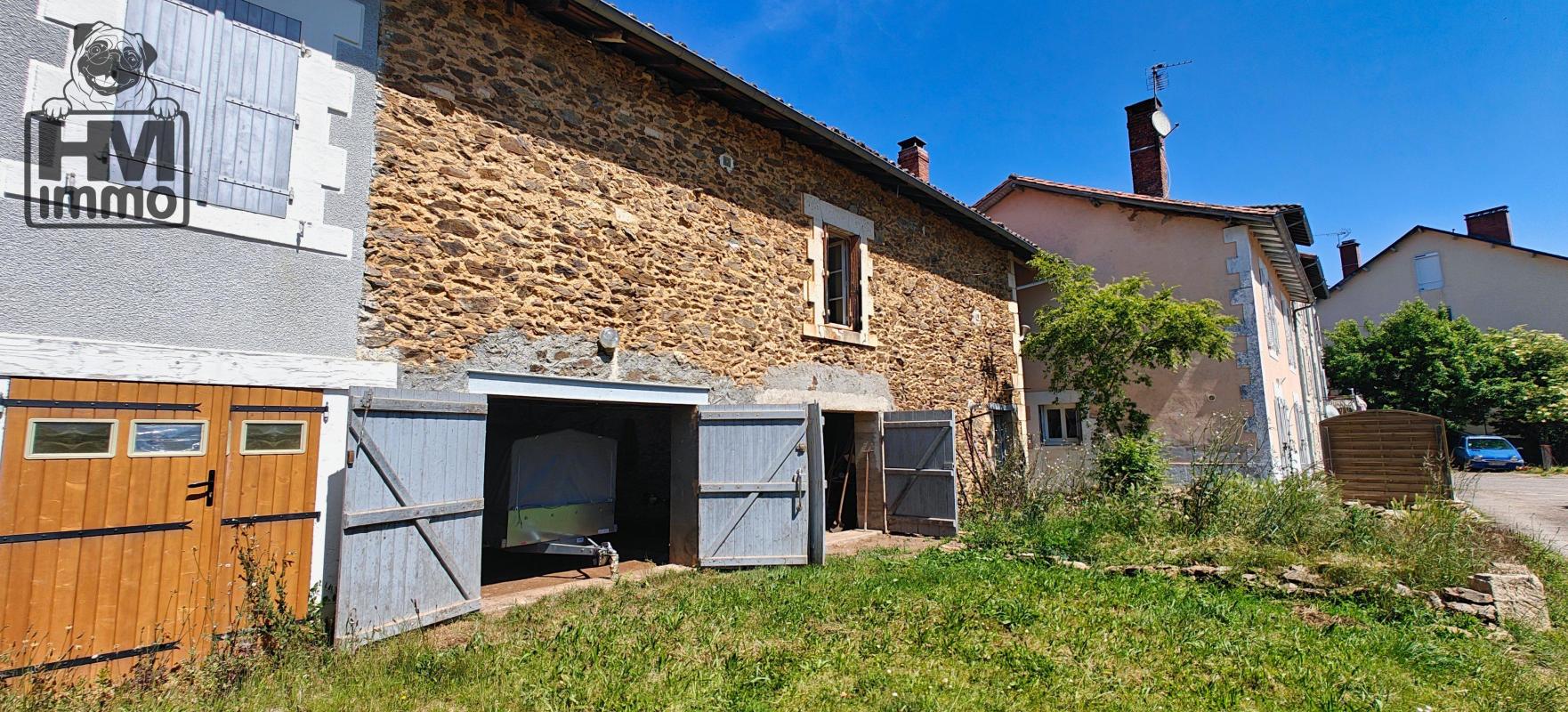 Maison de ville avec appartement, garage double et terrain constructible!